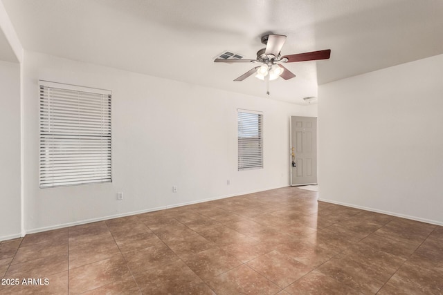 6085 S Wilson Dr, Chandler, AZ 85249 - tiled empty room with a ceiling fan and baseboards