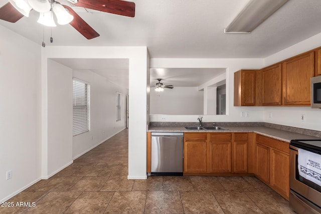 6085 S Wilson Dr, Chandler, AZ 85249 - kitchen with appliances with stainless steel finishes, ceiling fan, a sink, and brown cabinets