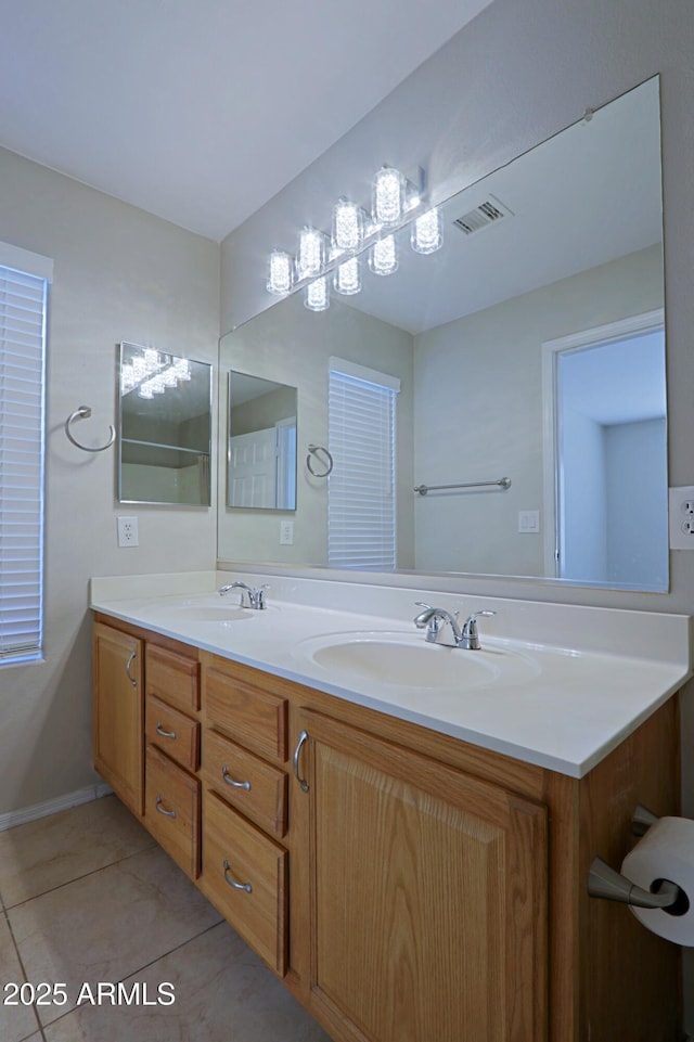 bathroom with tile patterned flooring and vanity