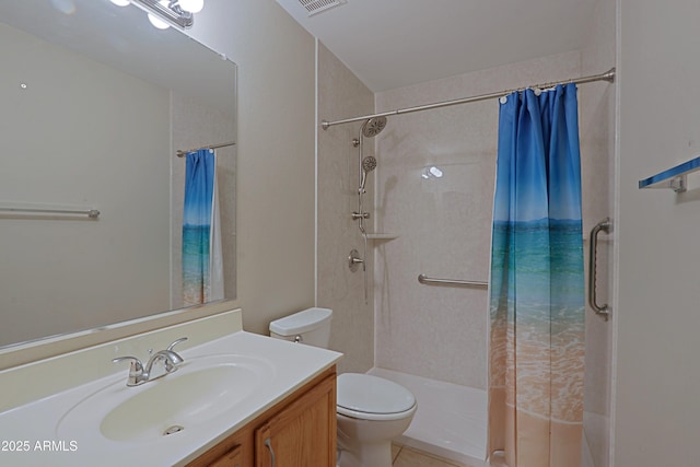 bathroom featuring a shower with shower curtain, tile patterned floors, vanity, and toilet