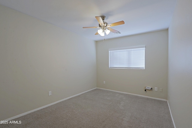 spare room with light carpet and ceiling fan