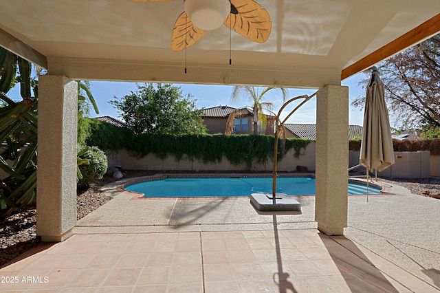view of pool with ceiling fan and a patio area
