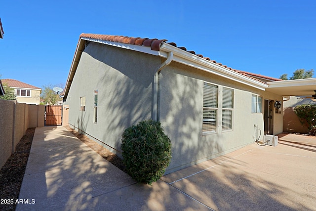 view of home's exterior featuring a patio area