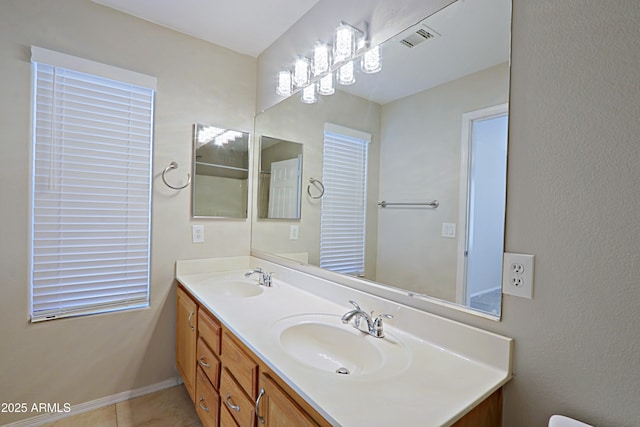 bathroom featuring tile patterned floors and vanity