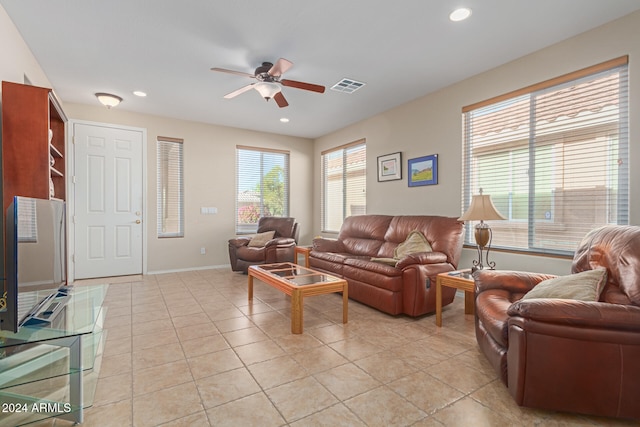 living room with ceiling fan and light tile patterned floors