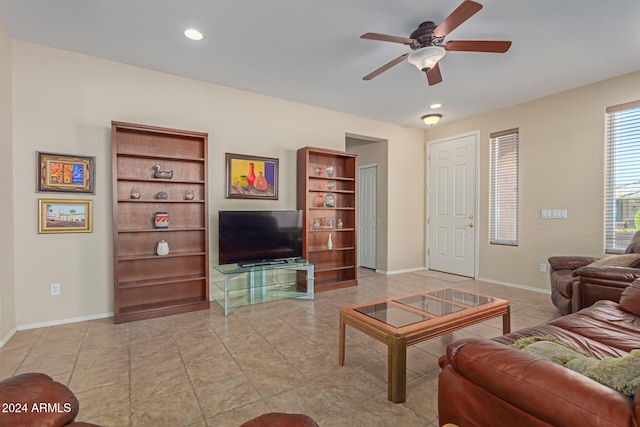 tiled living room with ceiling fan