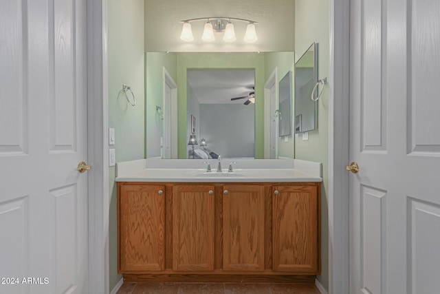 bathroom with vanity, tile patterned flooring, and ceiling fan