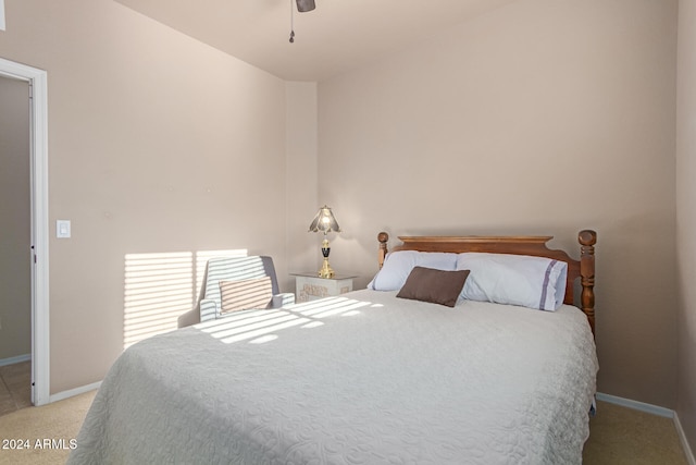 bedroom with light colored carpet and ceiling fan