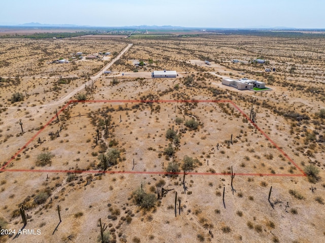 aerial view with view of desert, a rural view, and a mountain view