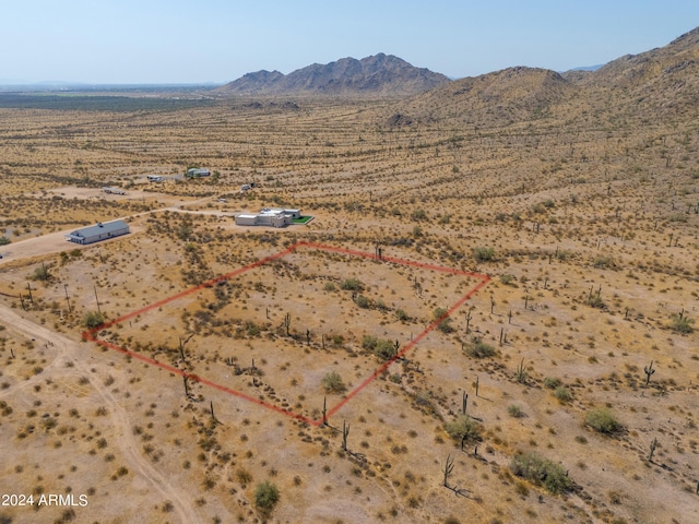 aerial view with a mountain view, a rural view, and view of desert