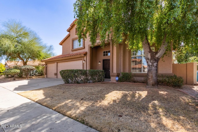 view of front facade featuring a tiled roof, a garage, driveway, and stucco siding