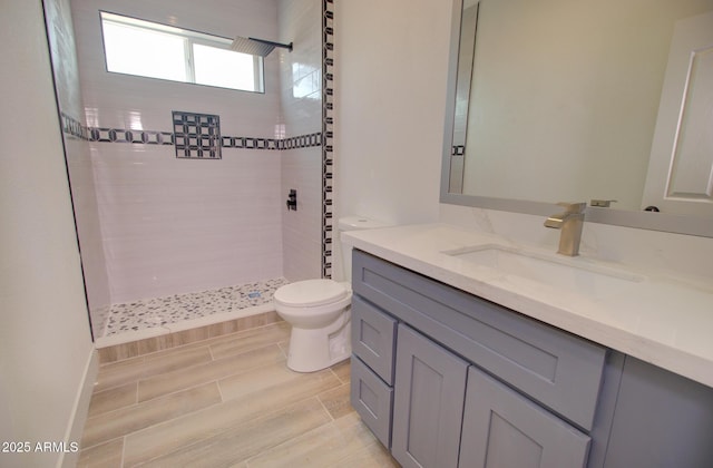 1519 N Etta St, Casa Grande, AZ 85122 - bathroom featuring toilet, a tile shower, and vanity
