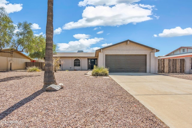 ranch-style house featuring a garage