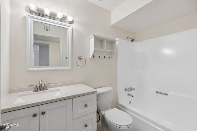 full bathroom featuring shower / tub combination, vanity, and toilet