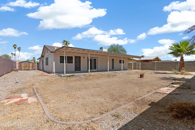 back of house featuring a patio