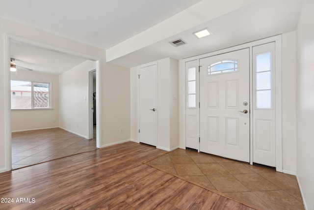 foyer with wood-type flooring and ceiling fan