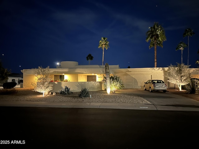 view of front of house featuring driveway and stucco siding