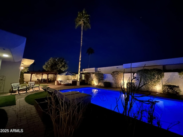 pool at twilight with a patio area, an outdoor living space, an outdoor pool, and a pergola