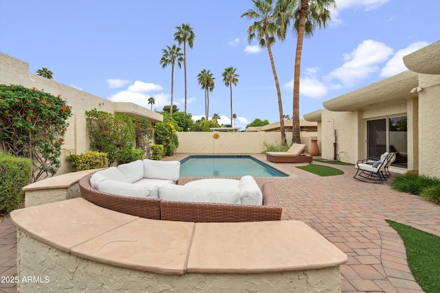 view of swimming pool with a patio area, a fenced backyard, outdoor lounge area, and a fenced in pool