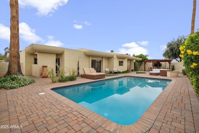 view of swimming pool featuring a pergola, a fenced in pool, a patio area, and an outdoor hangout area