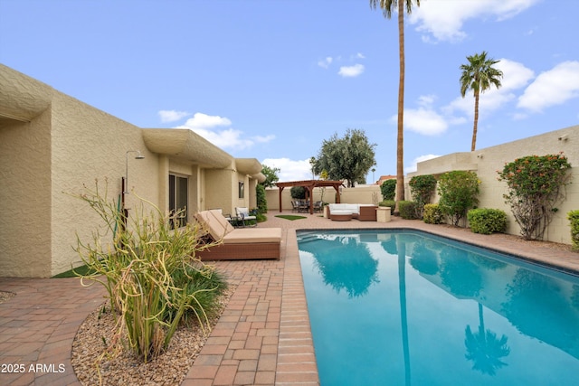 view of pool featuring a fenced in pool, a pergola, an outdoor living space, a patio area, and a fenced backyard