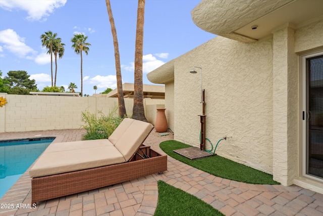 view of patio featuring a fenced in pool and a fenced backyard