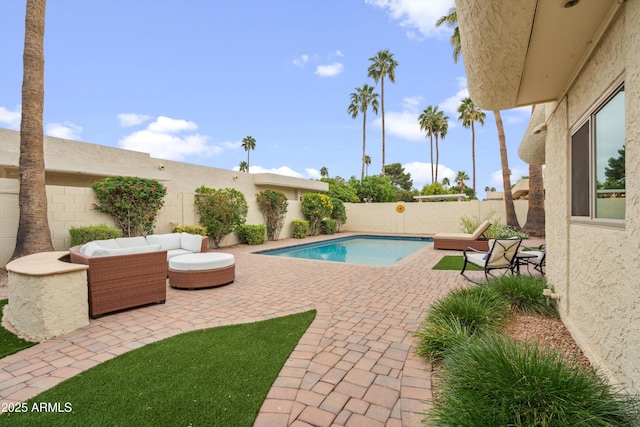view of swimming pool featuring a fenced in pool, a patio, outdoor lounge area, and a fenced backyard