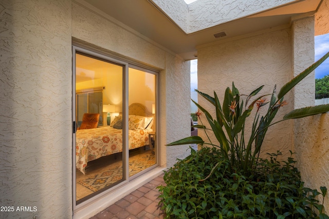 exterior space featuring a skylight and visible vents