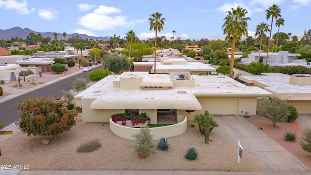 exterior space with a mountain view and a residential view