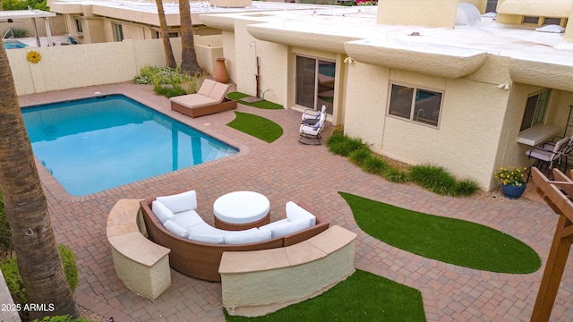 view of pool featuring a patio, a fenced backyard, and a fenced in pool
