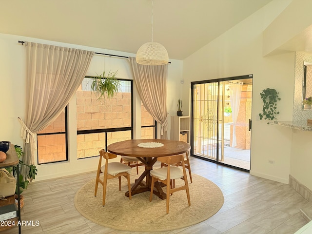 dining area with vaulted ceiling