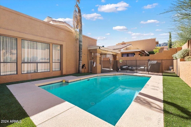 view of swimming pool with a patio area