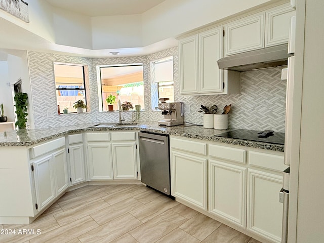 kitchen featuring decorative backsplash, light stone countertops, stainless steel dishwasher, black electric cooktop, and white refrigerator