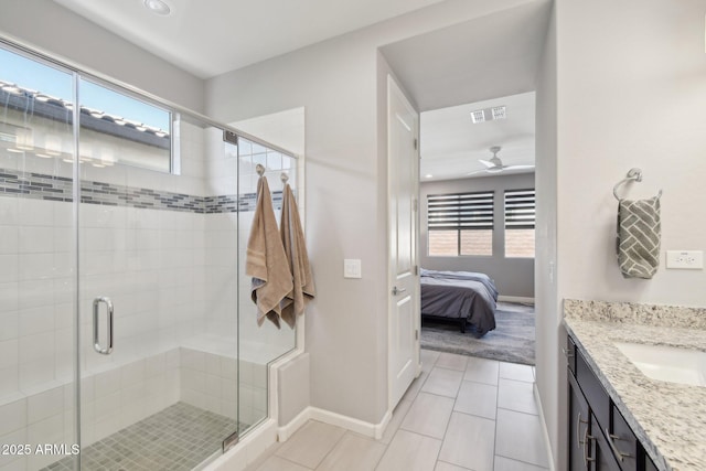 ensuite bathroom featuring tile patterned floors, visible vents, a healthy amount of sunlight, and ensuite bath