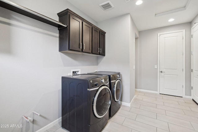 laundry area with visible vents, independent washer and dryer, recessed lighting, cabinet space, and baseboards