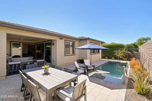 view of swimming pool featuring an outdoor living space, a fenced in pool, a fenced backyard, outdoor dining space, and a patio