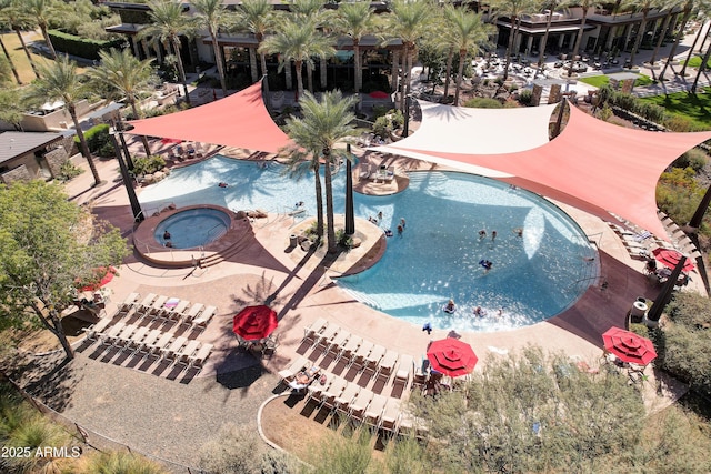 view of pool featuring a hot tub