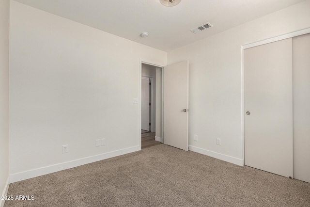 1727 W 12th Ave, Apache Junction, AZ 85120 - unfurnished bedroom with carpet floors and a closet