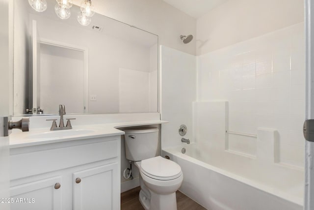 1727 W 12th Ave, Apache Junction, AZ 85120 - bathroom with vanity, shower / bathtub combination, and wood finished floors