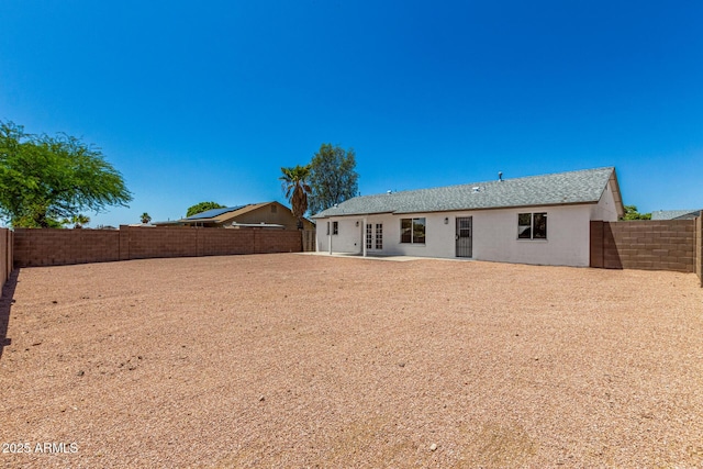 1727 W 12th Ave, Apache Junction, AZ 85120 - rear view of property with a fenced backyard and a patio area