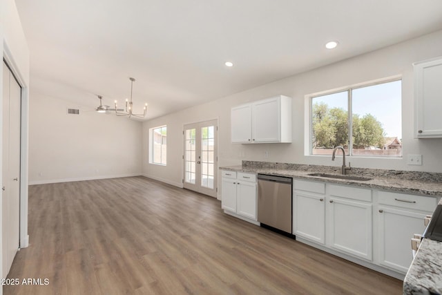 1727 W 12th Ave, Apache Junction, AZ 85120 - kitchen featuring dishwasher, white cabinets, light wood finished floors, light stone countertops, and recessed lighting
