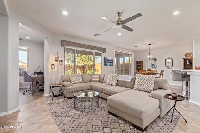 tiled living room featuring ceiling fan