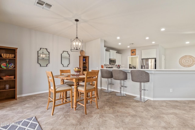 dining room featuring a notable chandelier