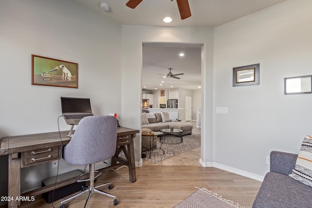 office with light hardwood / wood-style flooring