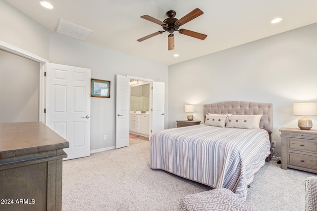 carpeted bedroom with connected bathroom and ceiling fan