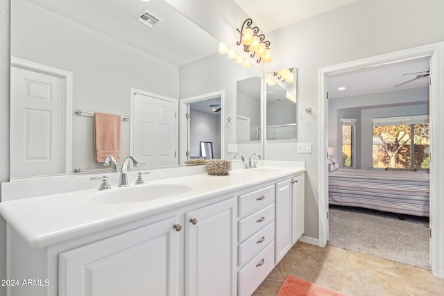 bathroom featuring tile patterned floors, vanity, and ceiling fan