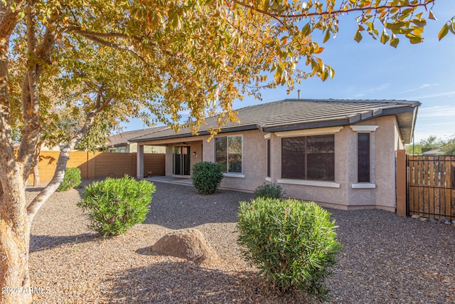 back of property with a patio area