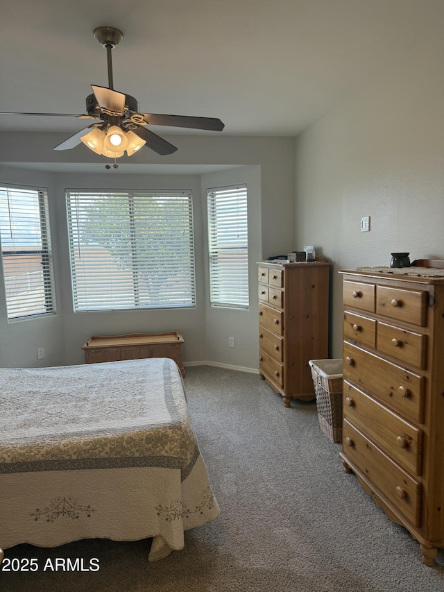 bedroom with baseboards, light carpet, and a ceiling fan