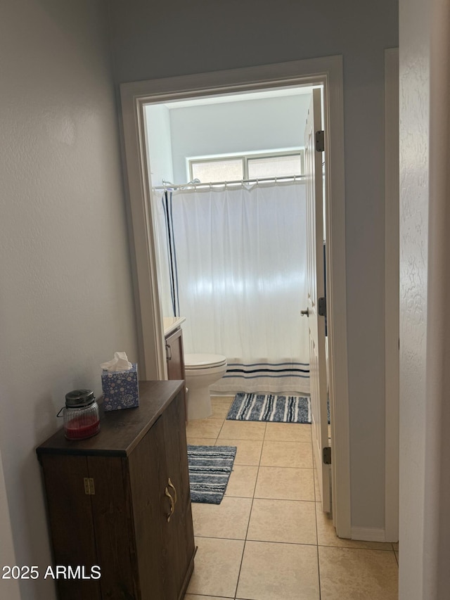 doorway to outside with light tile patterned floors