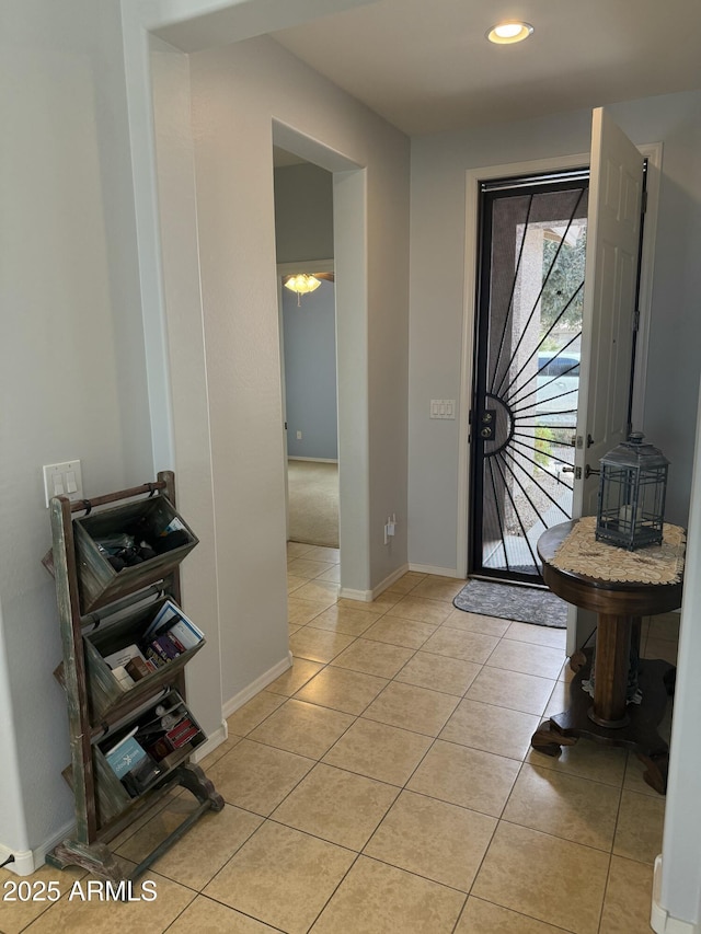 entrance foyer featuring light tile patterned floors, recessed lighting, and baseboards